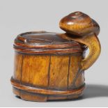 A boxwood netsuke of a snail on a bucket. Mid-19th centurySlithering over the side of a bucket,