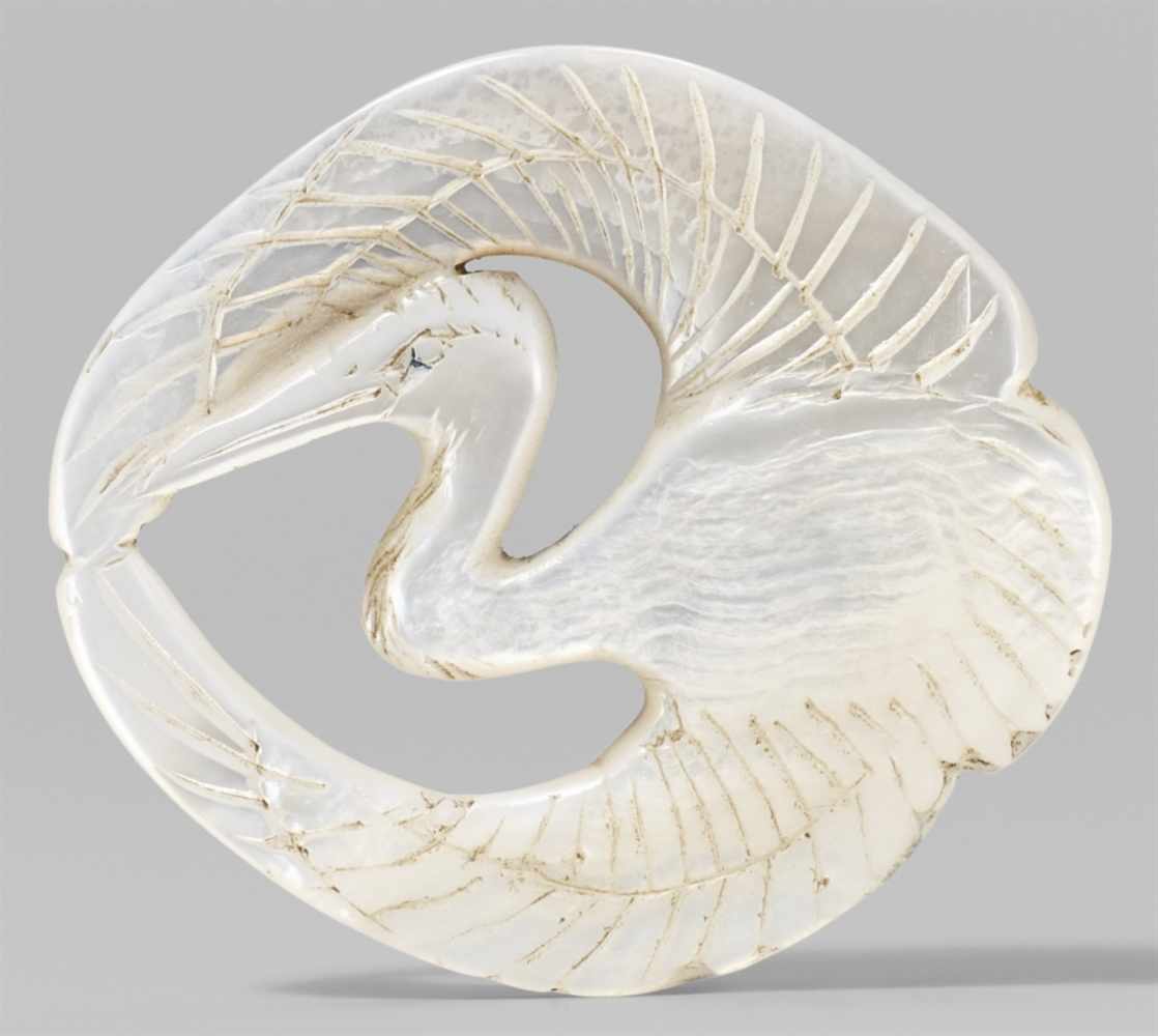 A mother-of-pearl netsuke of a crane. 19th centuryOf flat shape, with finely engraved eye area, beak