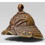 A brass ashtray netsuke of a kabuto. 19th centuryCast with a stylised insect forming the helmet