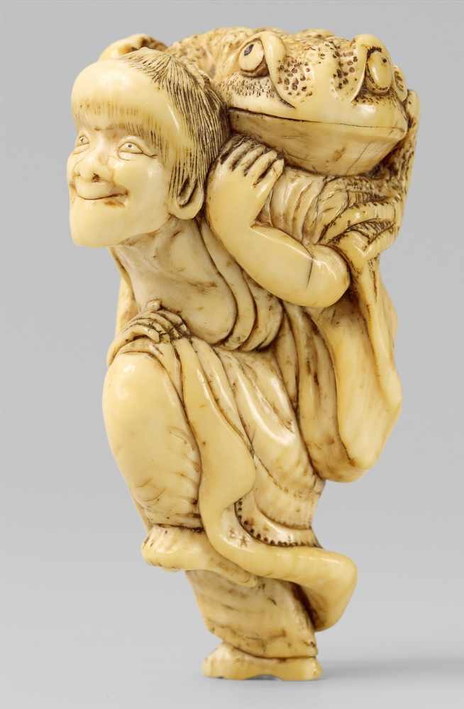 An ivory netsuke of Gama Sennin. Late 19th centuryStanding, supporting a large toad on his shoulder.