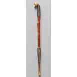 A fine bamboo and metal pipe (kiseru). Late 19th centuryThe tube (rau) of bamboo with cloud scrolls,