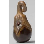 A lacquered wood netsuke of two ladybugs on an eggplant. 19th centuryThe eggplant covered with shiny