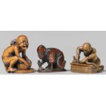 Three boxwood netsuke. 19th centurya) A luckless rat catcher, the eye inlaid in bone, signed