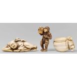 Three ivory netsuke. 19th centurya) A sleeping sarumawashi and a monkey reaching for the trainer’s