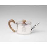 A George III London silver teapotOval teapot with wooden handle and an engraved coat of arms. H 11.2
