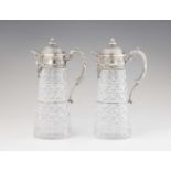 A pair of Bremen silver mounted glass carafesConical glass bottles with silver mountings, the