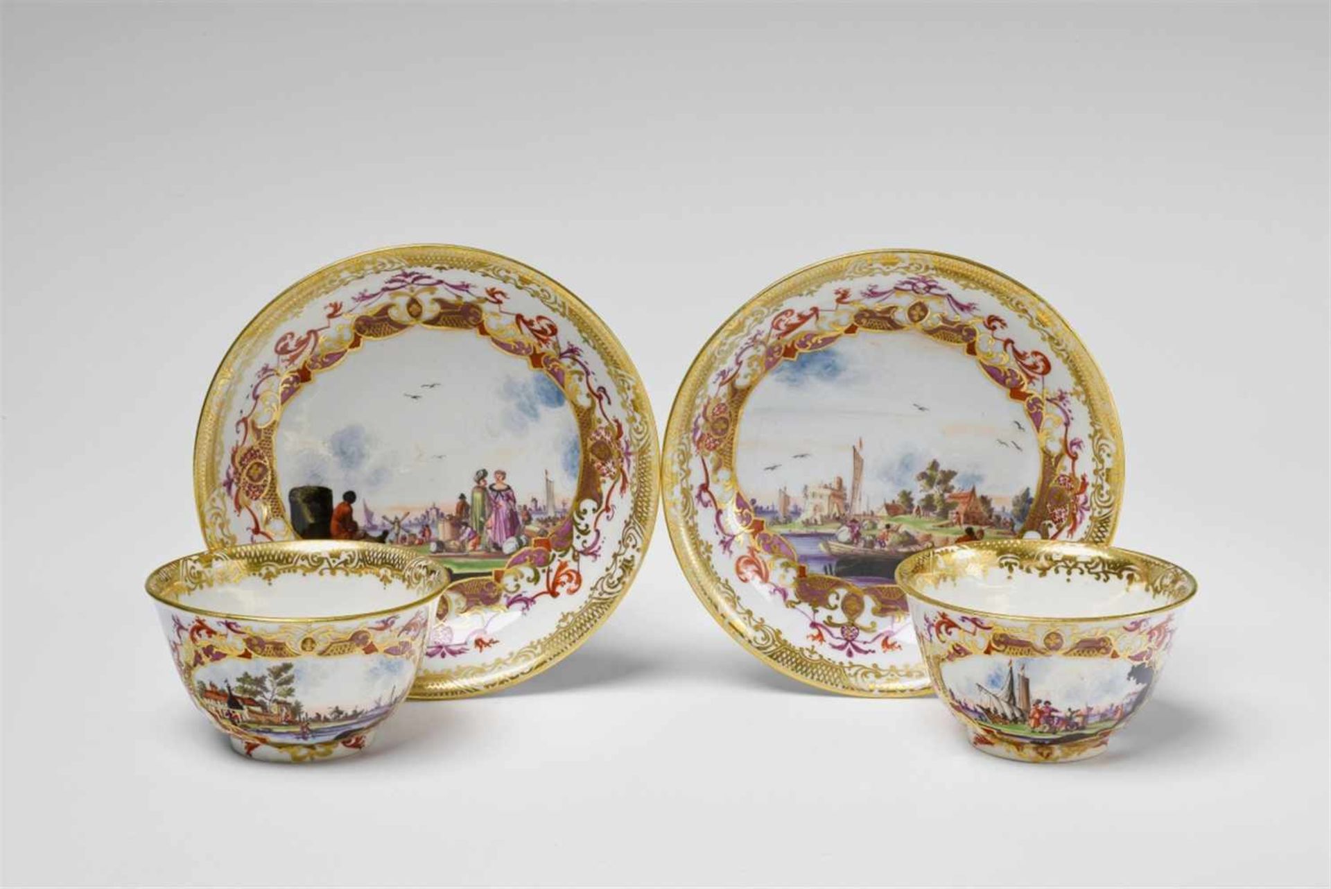 A pair of Meissen porcelain tea bowls with "kauffahrtei" scenesWith original saucer. Painted with
