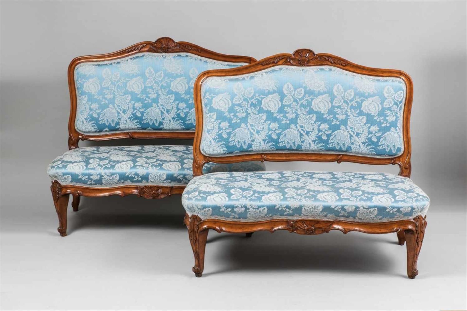 A pair of German walnut canapésModern textile covers. Restored. H 108, W 125, depth of seats 65