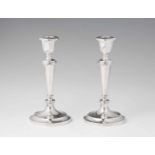 A pair of St. Petersburger silver candlesticksSolid silver candlesticks with fluted shafts, the vase