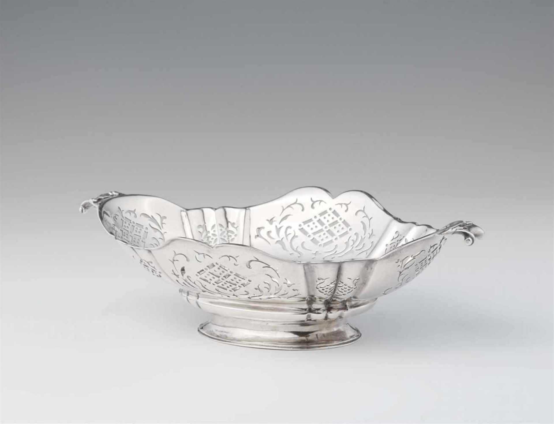 An Augsburg Baroque silver stembowlOval scalopped dish with handles. Decorated with pierced