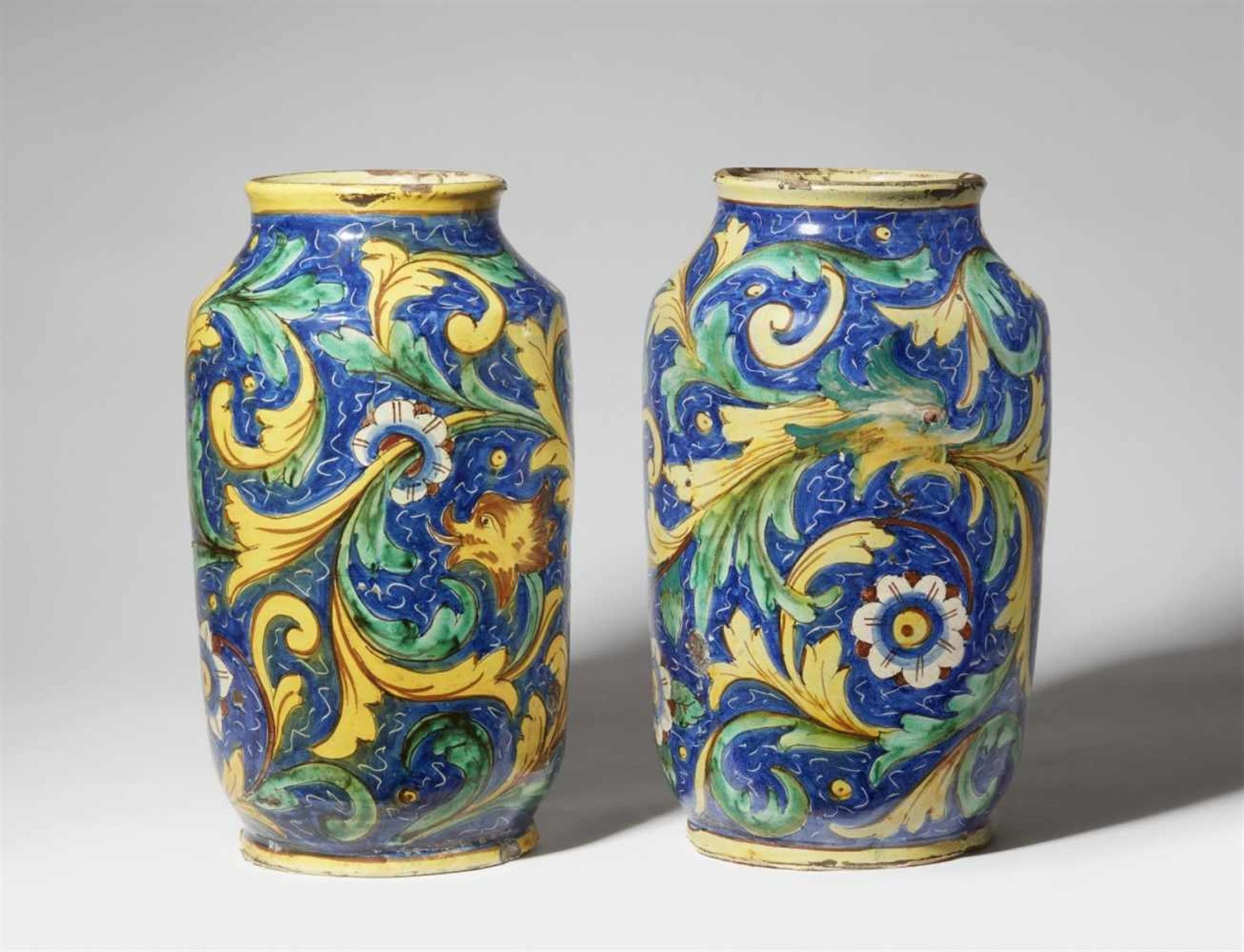 A pair of large Sicilian majolica albarelliOf near cylindrical section with slightly flaring rims.