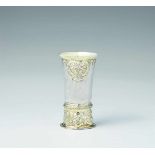 A Siebenbürgen parcel gilt silver "kluftbecher"Narrow tapering beaker on a tall base decorated