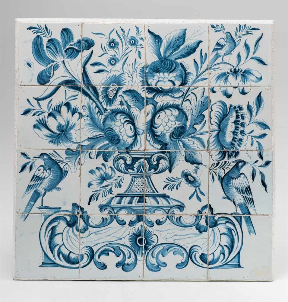 A Portuguese faience tile panelMounted on plaster. 16 tiles creating an image of a basket of flowers