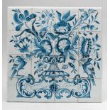 A Portuguese faience tile panelMounted on plaster. 16 tiles creating an image of a basket of flowers