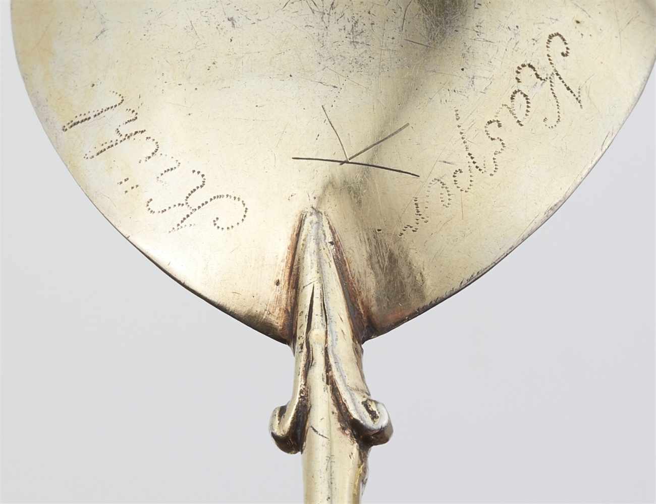 A silver gilt spoon with a hermDroplet shaped bowl and straight handle terminating in a Roman - Image 2 of 2