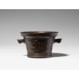 A rare mortar with a stork motifGolden brown bronze with slightly mottled brown patina. Of