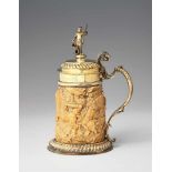 A large silver-mounted ivory tankard with Saint FlorianThe foot rim and domed lid decorated with