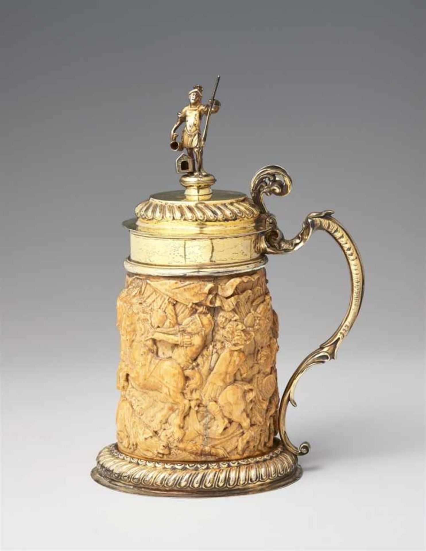 A large silver-mounted ivory tankard with Saint FlorianThe foot rim and domed lid decorated with