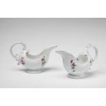 A pair of Meissen porcelain sauce boats from a service with wildflower decorBlue crossed swords