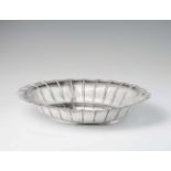 A George III silver dishA fluted oval shaped solid silver bowl. W 37; D 27.5; H 6.5 cm, weight 1,029