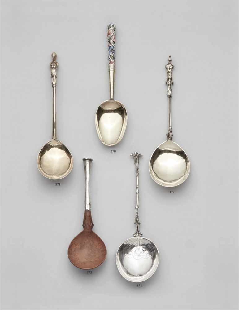 A silver gilt spoon with a hermDroplet shaped bowl and straight handle terminating in a Roman