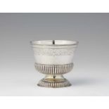 An Augsburg Régence silver beakerGadrooned silver beaker with remains of gilding and engraved