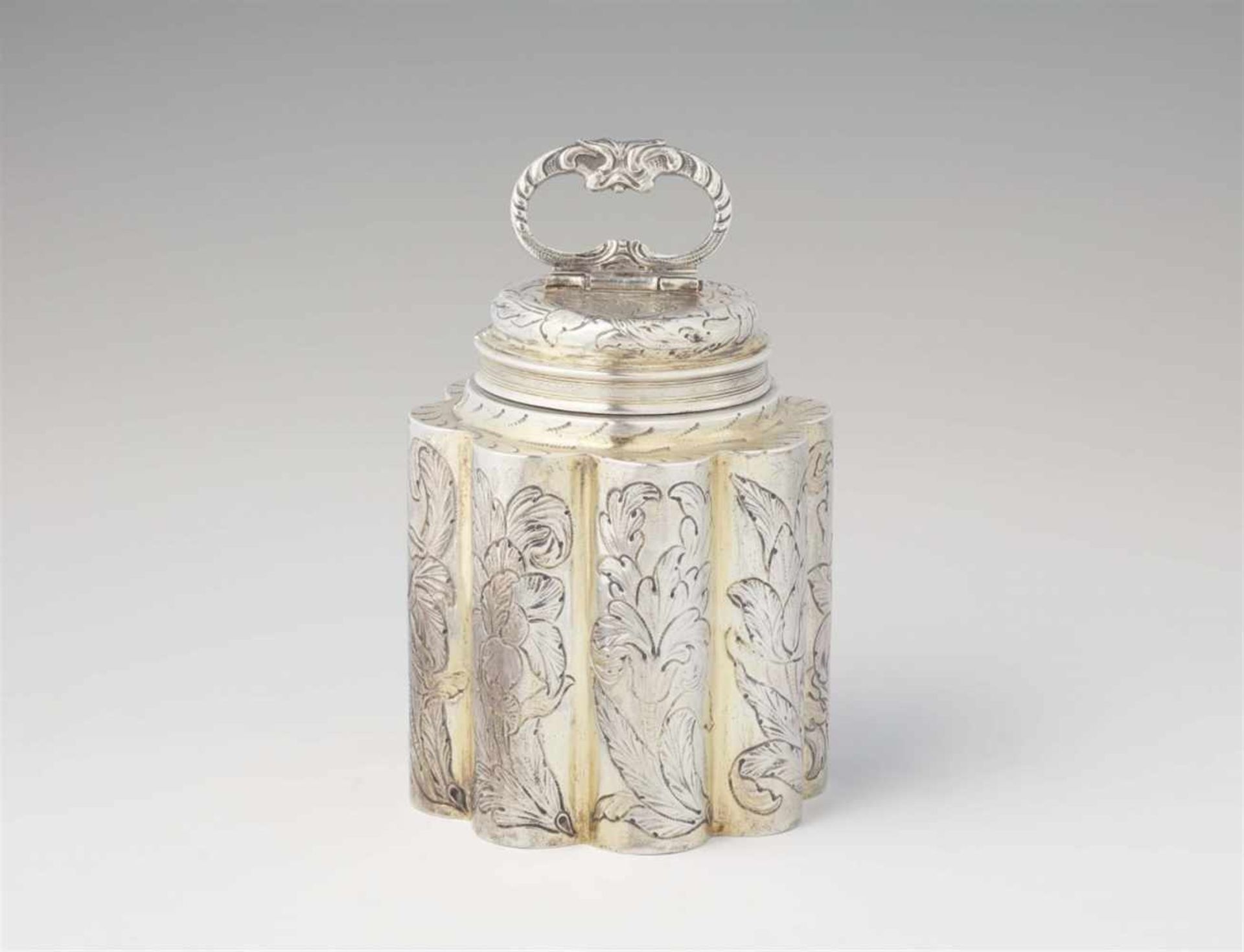 An Augsburg parcel gilt silver flaskOf octagonal section with screw top and hinged handle. Decorated