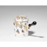 A Meissen porcelain hot chocolate pot with floral appliquesCylindrical vessel with ebonised wooden