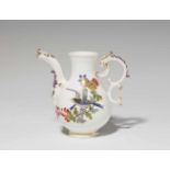A Meissen porcelain pitcher with flowers and birdsWith a later corresponding lid. Blue crossed