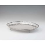 A Neoclassical Augsburg silver platterOval tray on four supports with pierced gallery rim. L 35.5; W