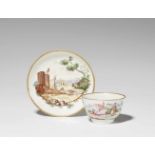 An Italian porcelain tea bowlTea bowl and saucer with landscapes and elegant figures. Red star mark.
