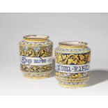 A pair of Italian majolica albarelliSquat cylindrical form with waisted neck, one inscribed "Goma