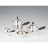 A Copenhagen silver service, no. 80Comprising a coffee pot, teapot, sugar bowl, and milk jug. H of
