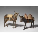 Two wooden donkeys from a Nativity scenePolychrome wood with glass eyes, textile and leather