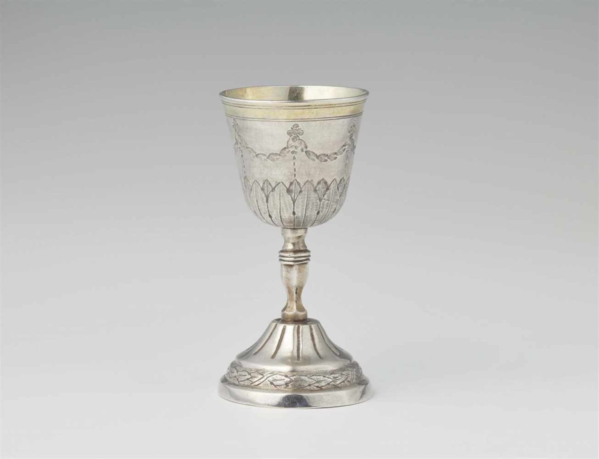 A small Berlin parcel gilt silver chaliceWith lancet and festoon decor. H 13 cm, weight 128 g. Marks