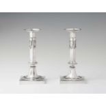 A pair of Cologne silver candlesticksFluted columns with festoons on square bases. H 22.5 cm, weight