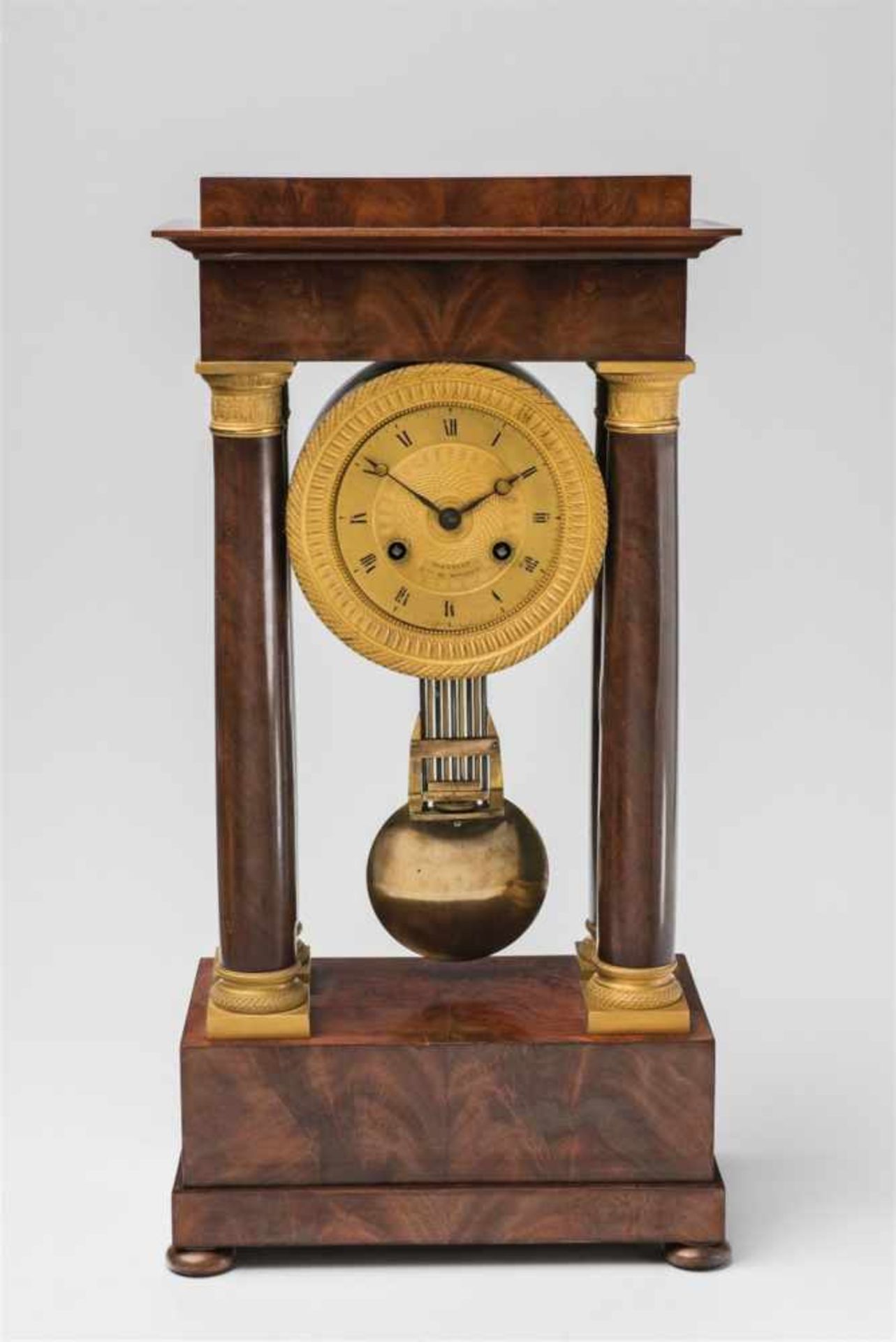 A French portico pendulum clockMahogany veneer on softwood, guilloched brass. 14-day movement with