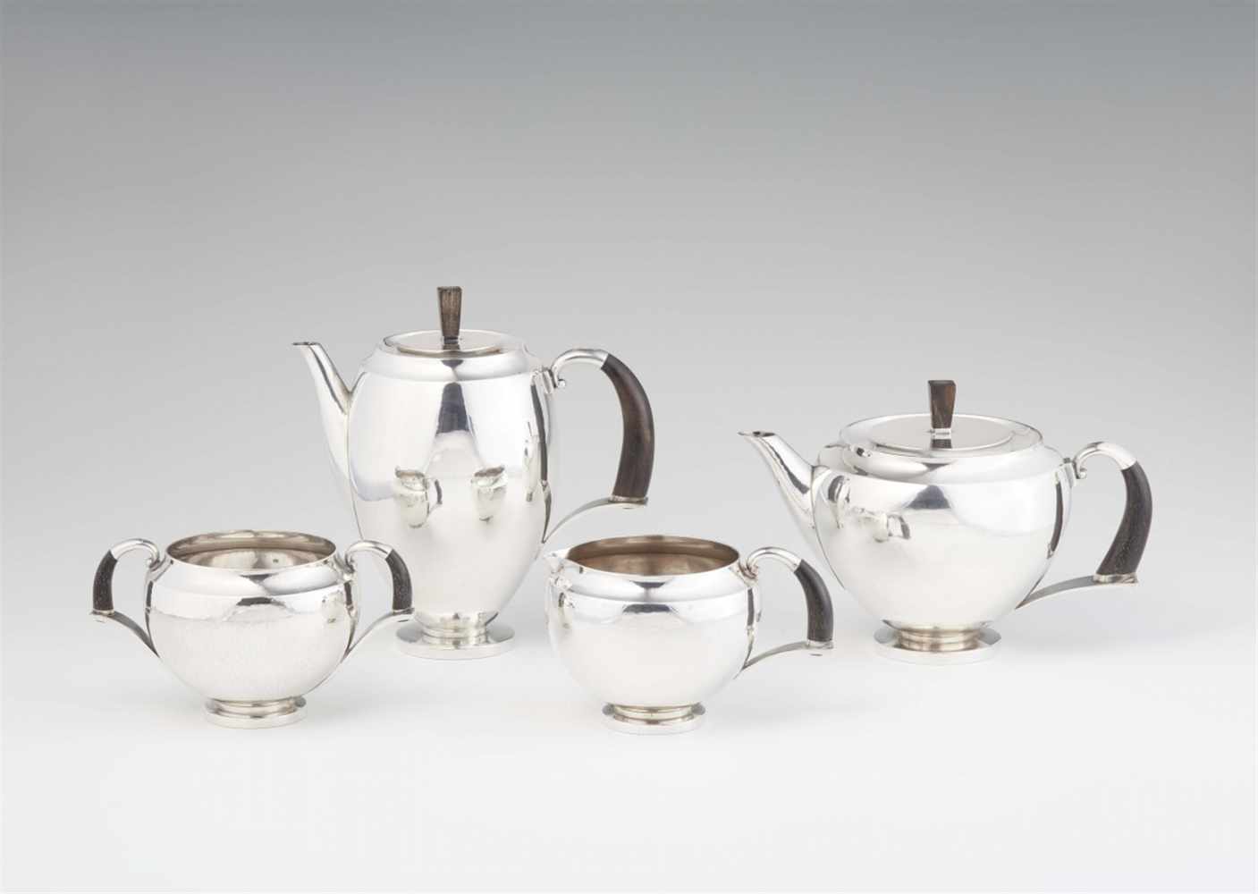 A rare Copenhagen silver service, no. 506Comprising a coffee pot, teapot, sugar bowl, and milk