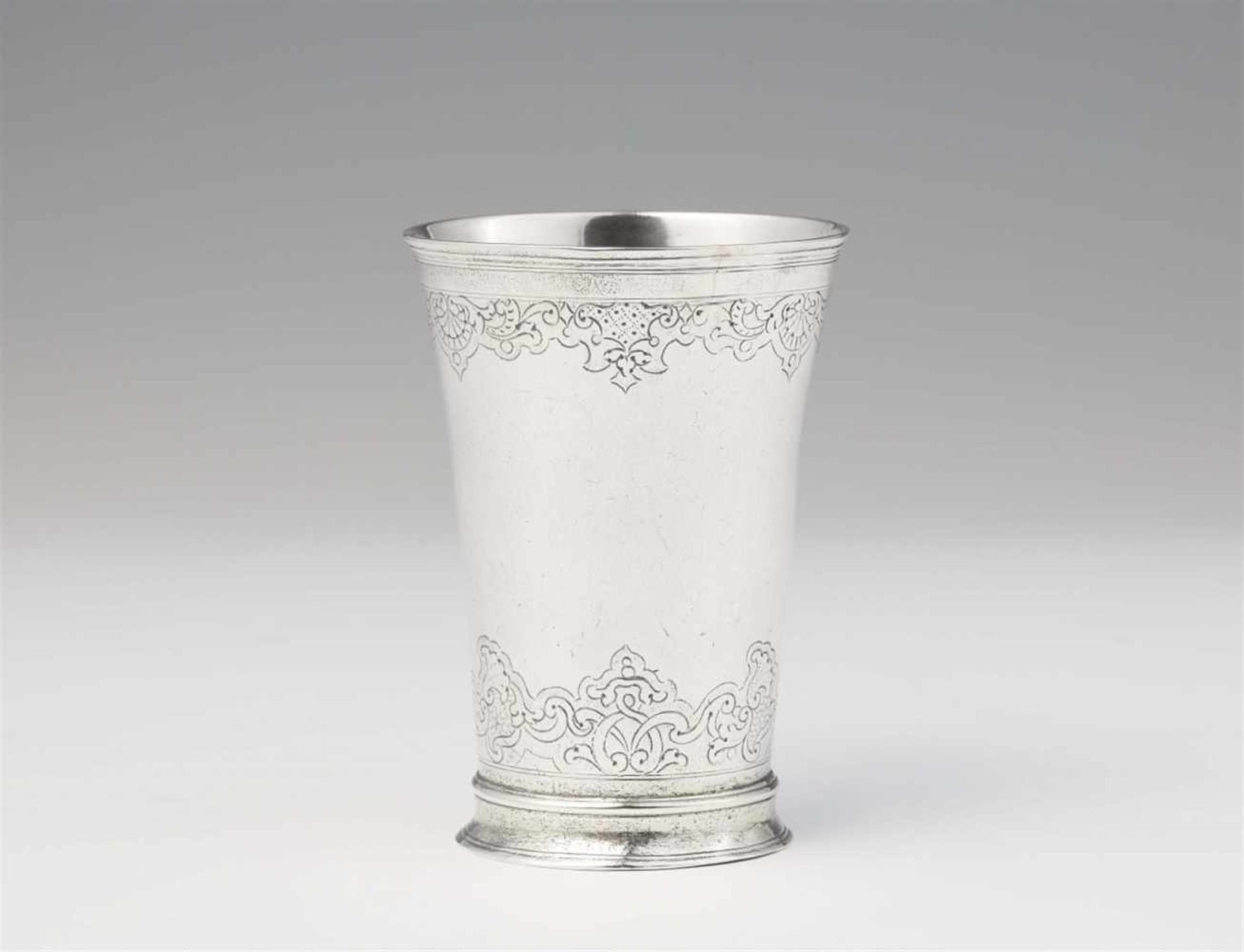 An Augsburg Régence silver beakerTapering beaker with remnants of gilding on a waisted base. H 9.2