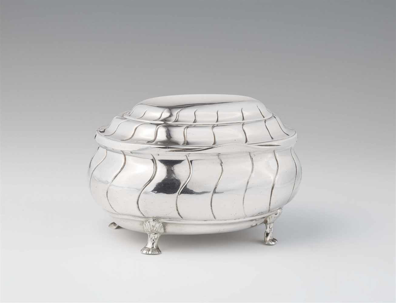 A rare Pforzheim silver sugar boxBombé form box with hinged lid and twist fluting. W 15; D 12; H