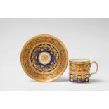 A Vienna porcelain cup with arabesque decor in the original caseCylindrical form with original