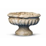 An oval white marble fountain basinTwo-part water fountain comprising a moulded bowl on a tapering