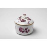A Meissen porcelain box and cover with woodcut flowersBlue crossed swords mark. The flowers