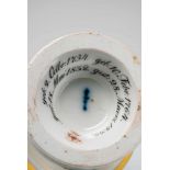 A Berlin KPM porcelain cup with relief portraits of Friedrich Philipp Rosenstiel and his wife"