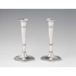 A pair of Neoclassical Parisian silver candlesticksPresumably after a design in bronze. Round