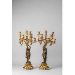 A pair of fire-gilt bronze candelabra with Flora and BacchusFire-gilt bronze eight-flame