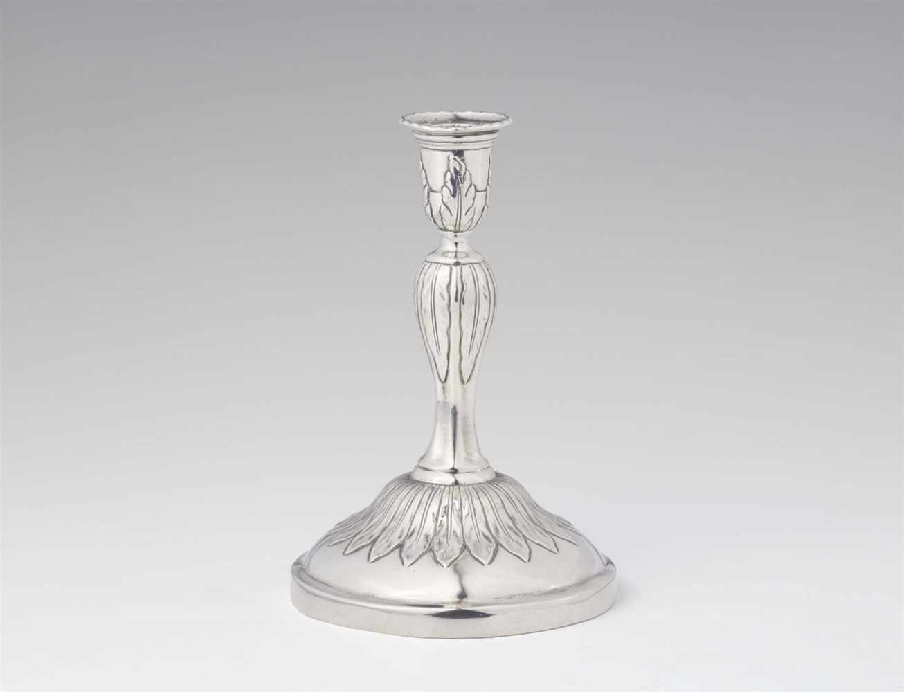 A silver candlestick from the court silver of DresdenBaluster form candlestick decorated with a