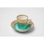 A Gothaer porcelain cup with seladon green groundWith original saucer. Blue R.g. mark and I. Ca.