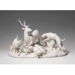 A biscuit porcelain group "Hallali du cerf"A large group showing five dogs attacking a stag. The