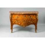 A Louis XV style chest of drawersPalisander, rosewood, maple, and stained wood on oak corpus, ormolu